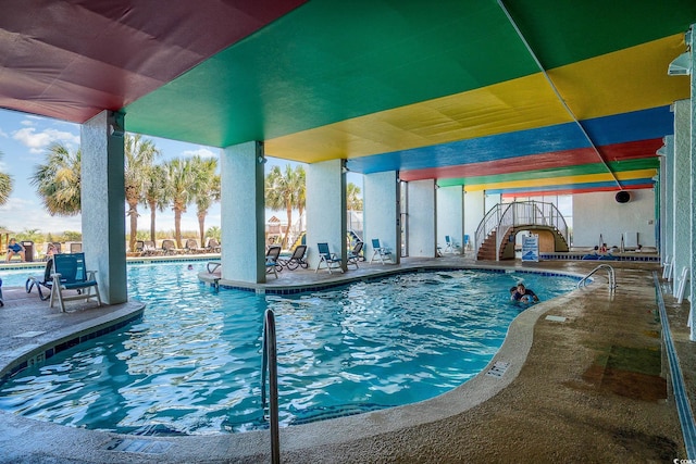 view of swimming pool featuring a patio area