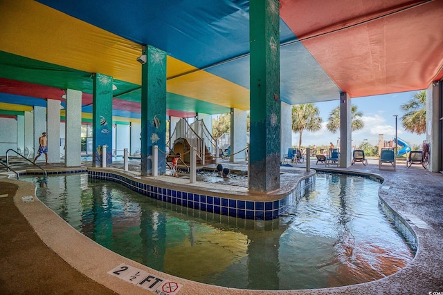 view of swimming pool with a patio area