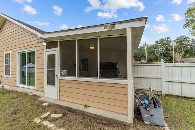 rear view of house with a sunroom