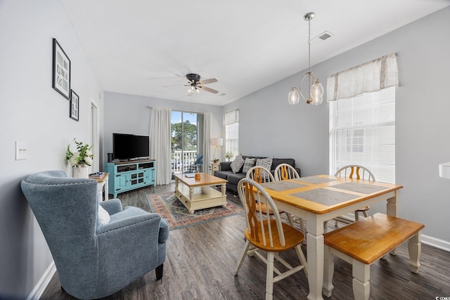 dining space with dark hardwood / wood-style floors and ceiling fan