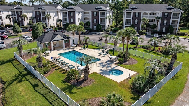 exterior space with an outdoor structure, a yard, and a patio area