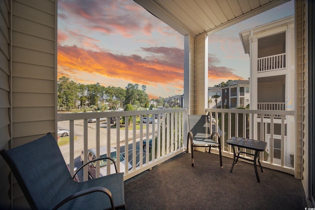 view of balcony at dusk