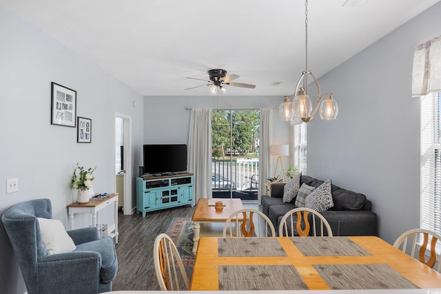 dining space with dark hardwood / wood-style floors and ceiling fan