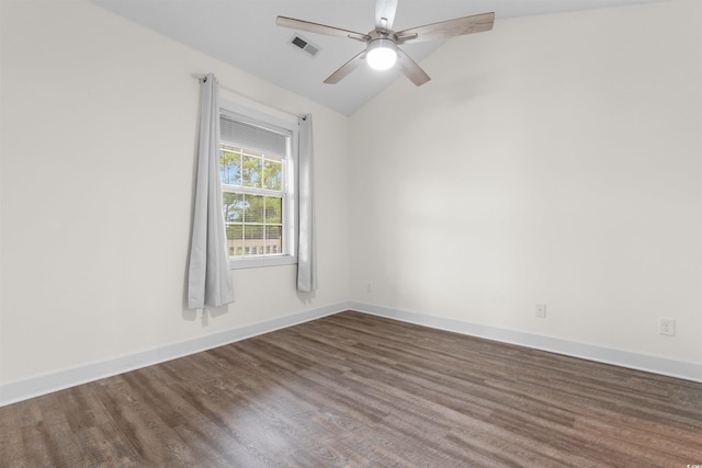 unfurnished room featuring ceiling fan, dark hardwood / wood-style floors, and vaulted ceiling