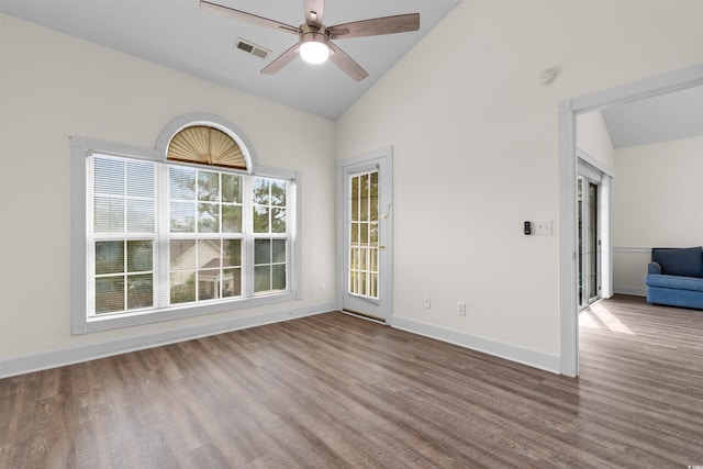 empty room featuring ceiling fan, hardwood / wood-style floors, and high vaulted ceiling