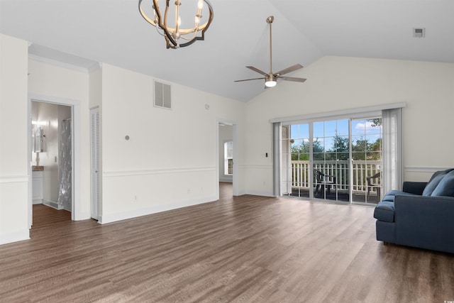 unfurnished living room featuring ceiling fan with notable chandelier, dark hardwood / wood-style floors, and lofted ceiling