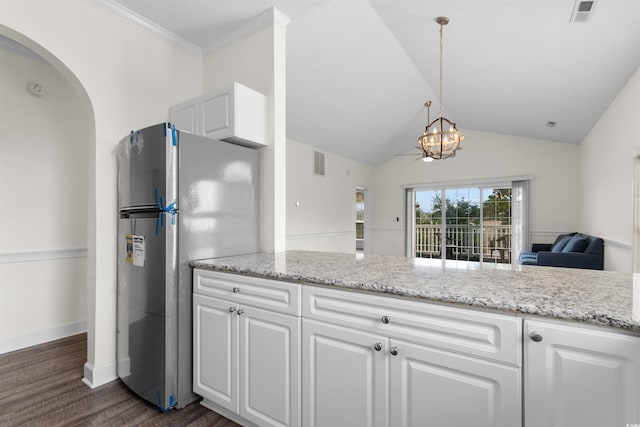 kitchen with dark wood-type flooring, an inviting chandelier, hanging light fixtures, white cabinetry, and stainless steel refrigerator