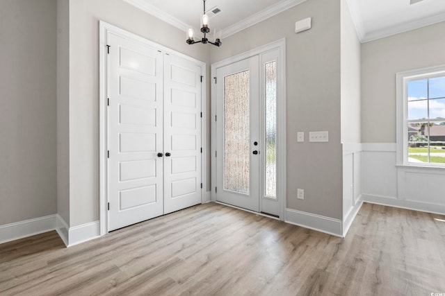 205 Waterfall Cir, Little River, SC 29566 - foyer featuring crown molding, wood finished floors, and a chandelier