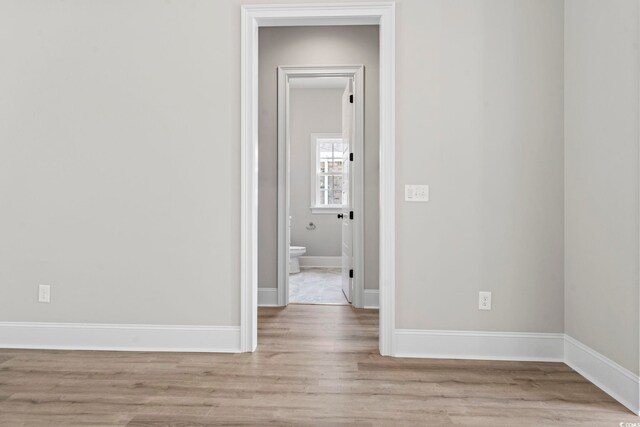 205 Waterfall Cir, Little River, SC 29566 - spare room featuring light wood-type flooring and baseboards