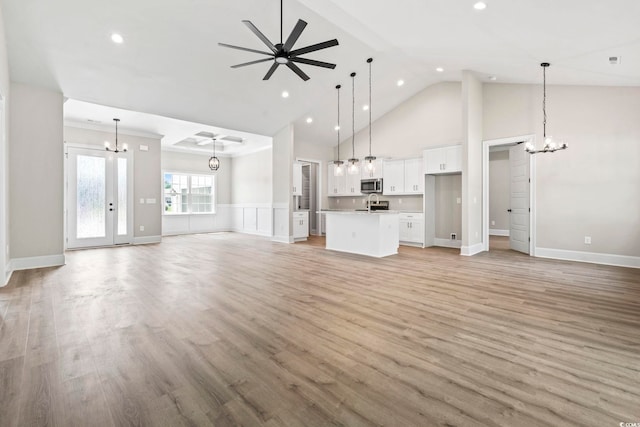 205 Waterfall Cir, Little River, SC 29566 - unfurnished living room featuring a chandelier, recessed lighting, light wood finished floors, a ceiling fan, and high vaulted ceiling