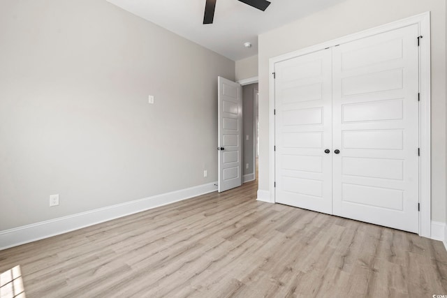 205 Waterfall Cir, Little River, SC 29566 - unfurnished bedroom with light wood-type flooring, a closet, and a ceiling fan