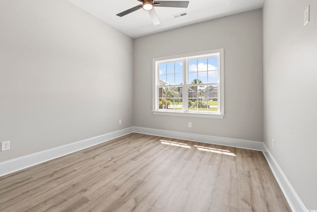 205 Waterfall Cir, Little River, SC 29566 - spare room featuring wood finished floors, a ceiling fan, and baseboards