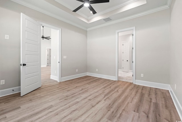 205 Waterfall Cir, Little River, SC 29566 - unfurnished bedroom with a raised ceiling, light wood finished floors, crown molding, ensuite bath, and ceiling fan