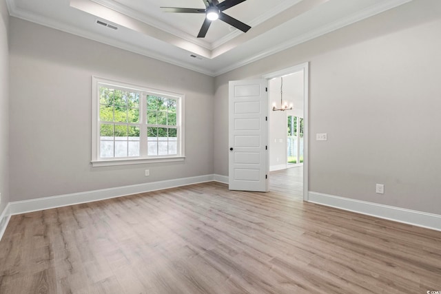 205 Waterfall Cir, Little River, SC 29566 - unfurnished room featuring light wood-type flooring, a raised ceiling, ornamental molding, ceiling fan, and baseboards