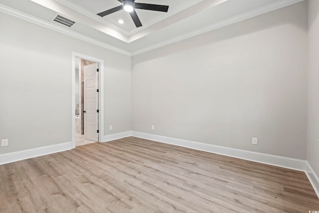 205 Waterfall Cir, Little River, SC 29566 - spare room with ornamental molding, wood finished floors, a tray ceiling, ceiling fan, and baseboards
