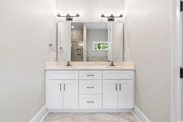 205 Waterfall Cir, Little River, SC 29566 - bathroom featuring a shower stall, baseboards, marble look tiles, and double vanity