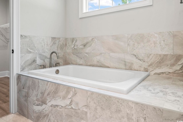 205 Waterfall Cir, Little River, SC 29566 - bathroom with a garden tub and a walk in closet