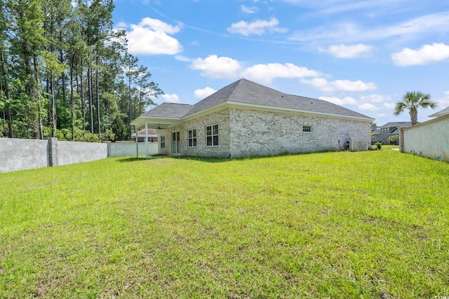 205 Waterfall Cir, Little River, SC 29566 - back of property featuring a ceiling fan and brick siding