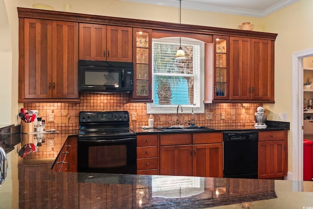 kitchen featuring black appliances, sink, crown molding, dark stone counters, and backsplash