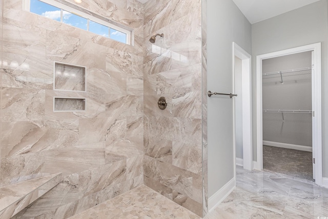 bathroom featuring a tile shower