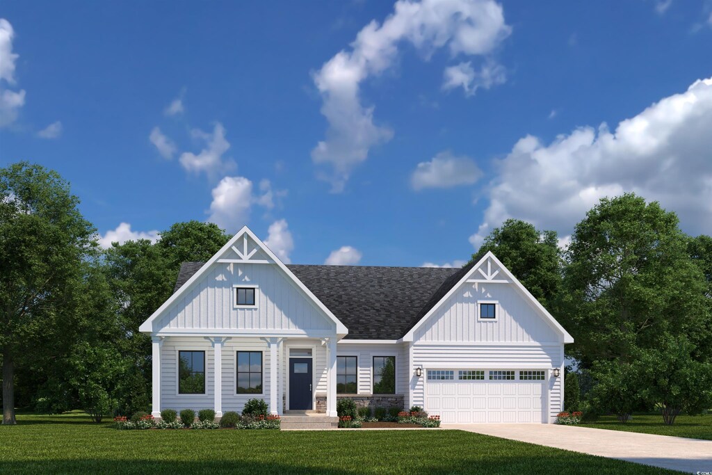 view of front facade featuring a garage and a front lawn