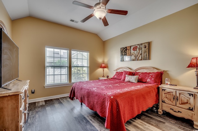 bedroom featuring ceiling fan, vaulted ceiling, and dark hardwood / wood-style floors