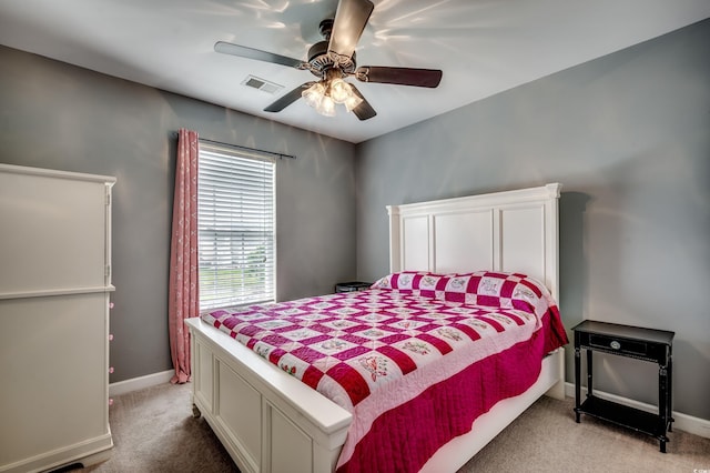 bedroom with ceiling fan and light colored carpet