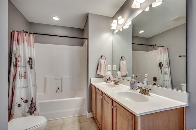 full bathroom with vanity, tile patterned floors, toilet, and shower / tub combo with curtain