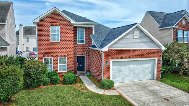 front facade featuring a garage and a front lawn