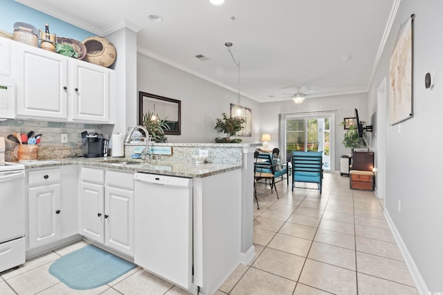 kitchen featuring white appliances, white cabinetry, sink, and kitchen peninsula