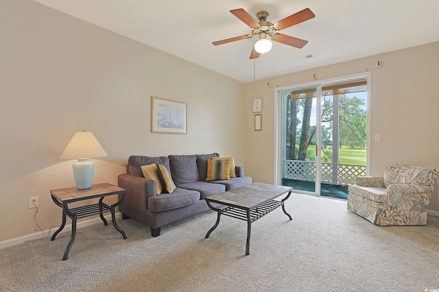 living room featuring carpet and ceiling fan