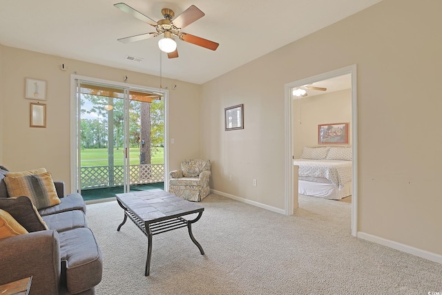 living room with light carpet and ceiling fan