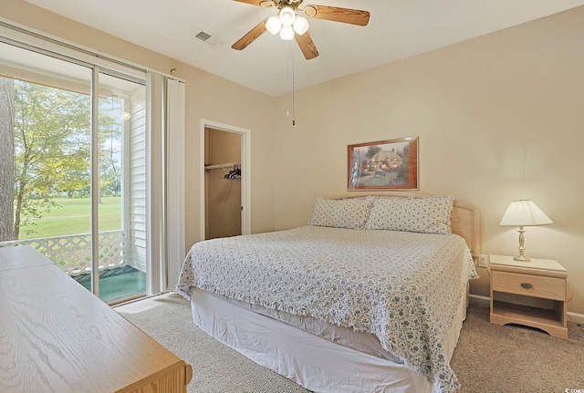 bedroom with carpet, ceiling fan, access to exterior, a spacious closet, and a closet