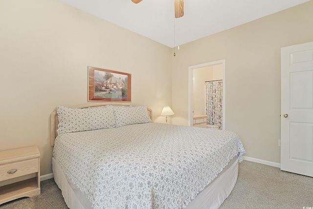 carpeted bedroom featuring ensuite bathroom and ceiling fan