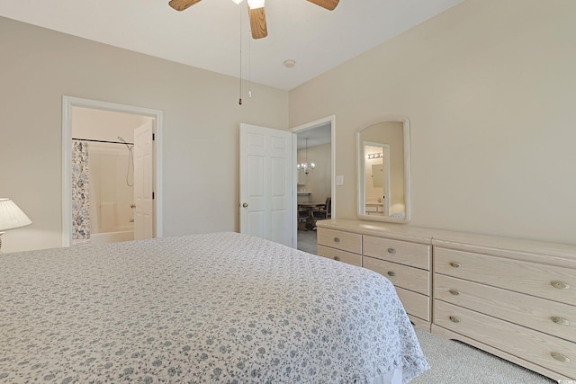 bedroom with ceiling fan, carpet floors, and connected bathroom