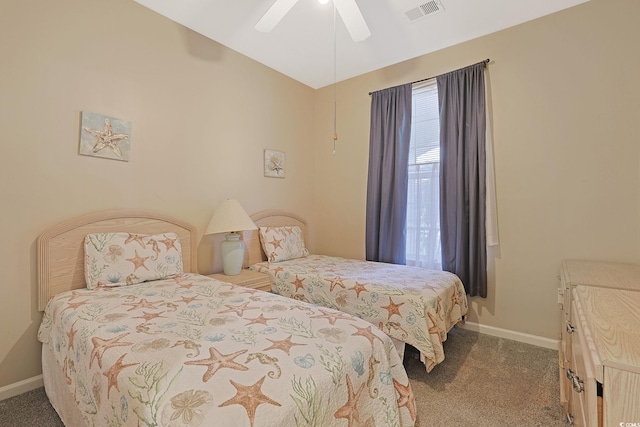 bedroom featuring ceiling fan and carpet