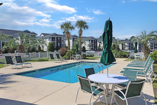 view of swimming pool with a patio area