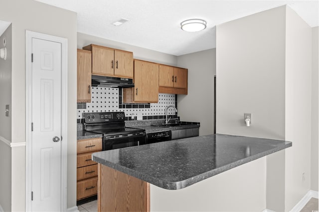 kitchen with a breakfast bar, black appliances, sink, tasteful backsplash, and kitchen peninsula