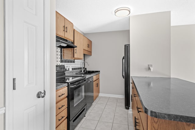 kitchen with black appliances, light tile patterned flooring, sink, and tasteful backsplash