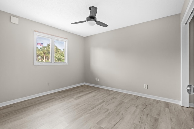 empty room featuring ceiling fan and light wood-type flooring