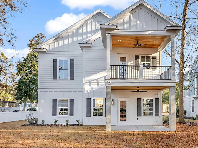 view of front facade featuring ceiling fan, a patio area, a balcony, and a front lawn