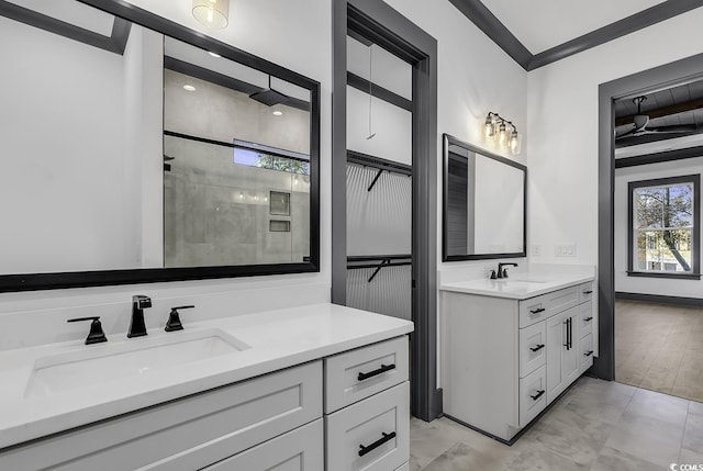 bathroom with a shower, crown molding, and vanity