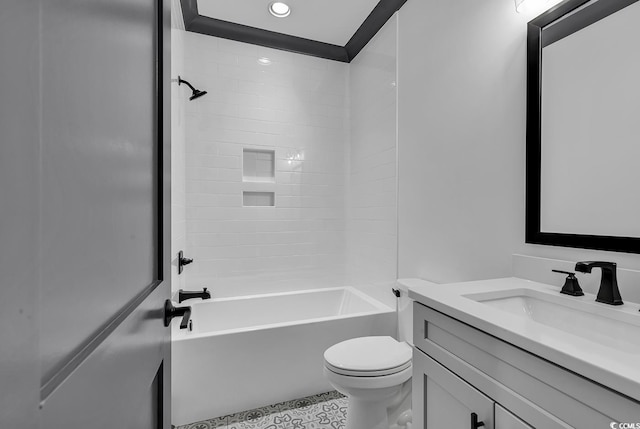 full bathroom featuring vanity, toilet, and tiled shower / bath