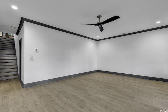 spare room with ceiling fan, light hardwood / wood-style floors, and ornamental molding