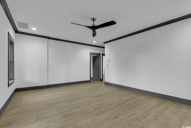 spare room with ceiling fan, light wood-type flooring, and crown molding