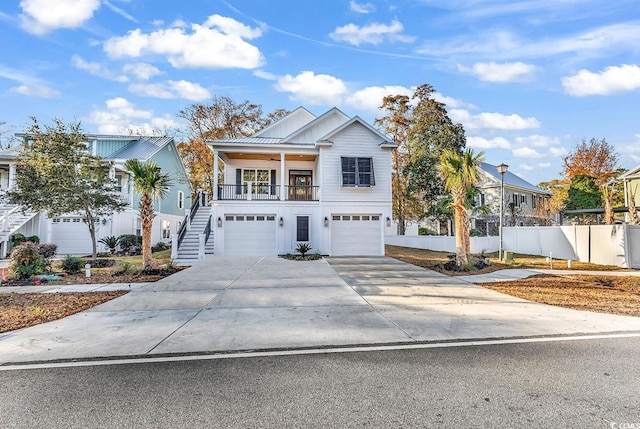 view of front of house featuring a porch and a garage