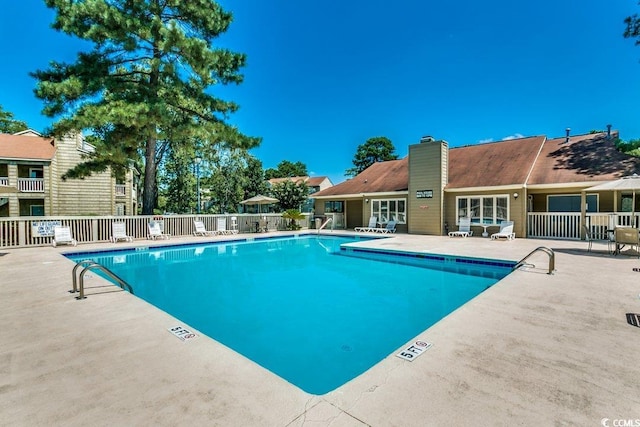 view of swimming pool with a patio