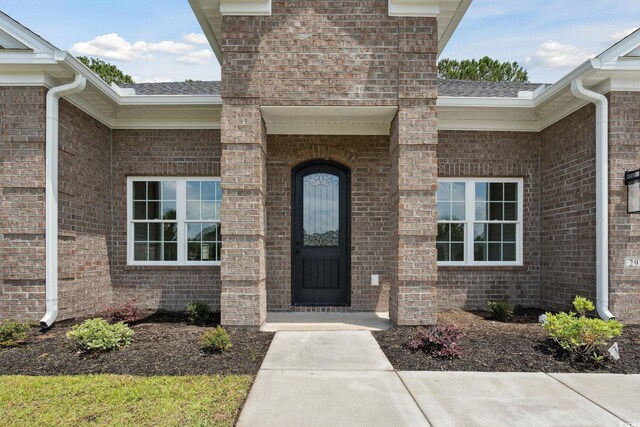 309 Waterfall Cir, Little River, SC 29566 - entrance to property featuring brick siding and a shingled roof