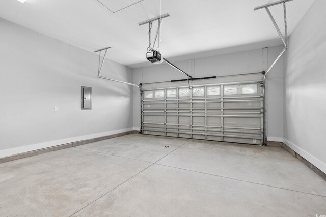 309 Waterfall Cir, Little River, SC 29566 - garage with electric panel, baseboards, and a garage door opener