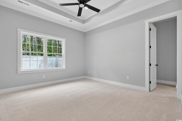309 Waterfall Cir, Little River, SC 29566 - unfurnished room featuring ornamental molding, a ceiling fan, light carpet, a tray ceiling, and baseboards